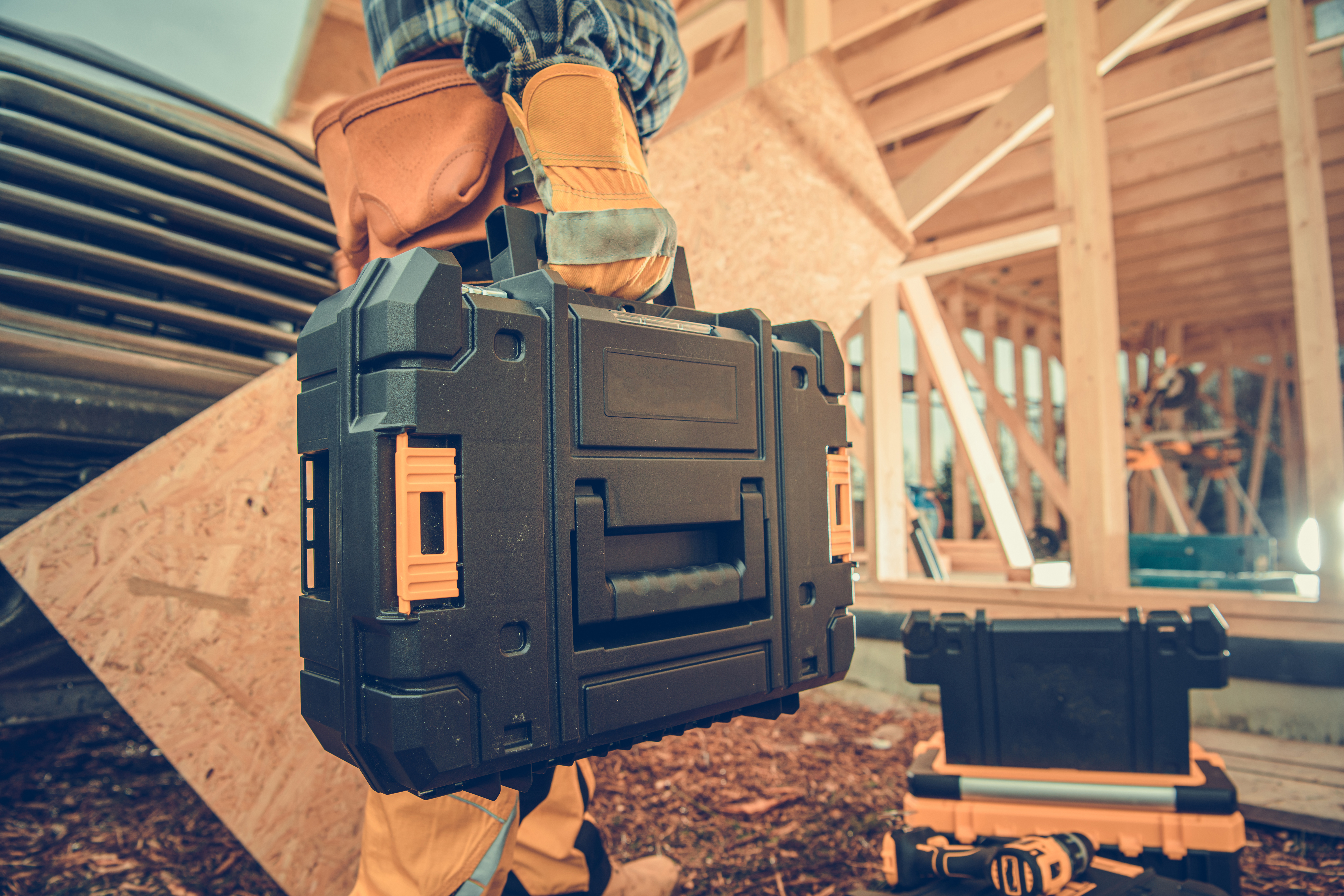 Builder Carrying a toolbox 